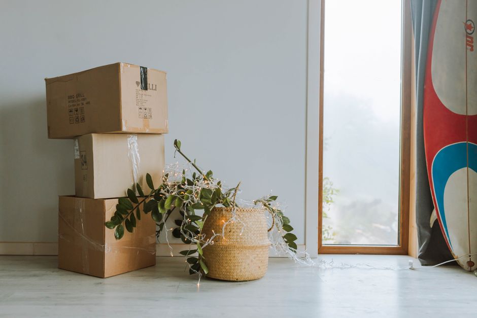 Unpacking boxes and organizing a new living room space